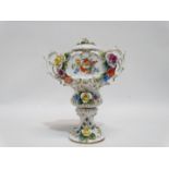 An early 20th century continental twin handled jar and cover - encrusted with roses and flowers,
