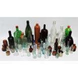 A collection of 19th and early 20th century bottles - some branded examples, together with stoneware