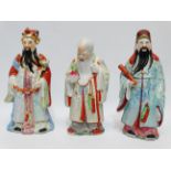 A Chinese Republic figure of a scholar - holding a septre, decorated in polychrome enamels,