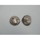 Two unidentified Roman silver dinari.