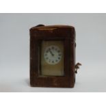 An early 20th century Grand Sonnerie carriage clock - with a brass corniche case, the white enamel