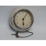 A mid 20th century Russian bulkhead clock - possibly from a submarine, the cream dial set out in
