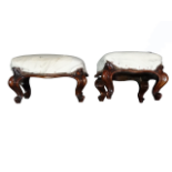 A pair of Victorian walnut footstools by Taylor & Sons - rectangular with short cabriole legs,
