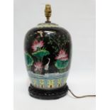 A Chinese 20th century vase - converted to a lamp, decorated with aquatic flowers and foliage on a