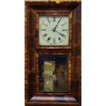 An early 20th Century American wall clock - the white painted dial set out with Roman numerals,