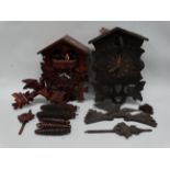 A 20th century German cuckoo clock - in a traditional case with dancing figures on the hour,