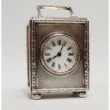 A silver cased carriage timepiece - London 1922, the engine turned case with harebell borders,