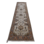 A 20th century Indian wool runner - 'Ivory and Rust' pattern, 90 x 348cm.