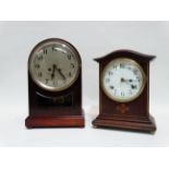 An early 20th century American mahogany cased mantel clock - the white enamel dial set out in Arabic