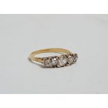 A diamond five stone ring - rubover setting in a 18ct yellow gold band, weight 2.6g, size Q.