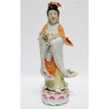 A Chinese Republic figure of Gualin - polychrome decorated and standing on a lotus flower, impressed