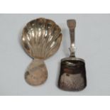 A Georgian silver caddy spoon - Birmingham 1790, of shovel form, together with another shell