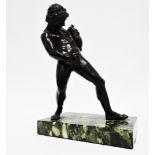 After the Antique - a 19th century cast and patinated bronze study of a young satyr with a wineskin,