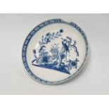 A Bow saucer - circa 1760, with an unusual pattern of a bird perched above a rocky island,