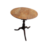 A George III fruitwood tripod table - the oval top with a shell inlay, above a birdcage and turned