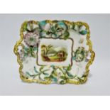 An early 19th century Staffordshire rectangular dish - encrusted with flowers, the centre