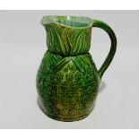 A glazed pottery jug in the form of a pineapple - height 17cm.