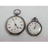 A silver cased open face pocket watch - foliate engraved with a white enamel dial set out with Roman