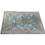 An early 20th century Aesthetic Movement flat weave rug - the foliate design on a turquoise ground
