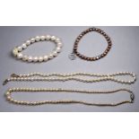 A string of uniform pearls - with 9ct gold clasp, length 41cm, together with three further strings