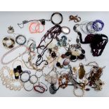 A quantity of costume jewellery - including bangles and necklaces (qty)
