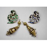 A serpent brooch by Atwood & Sawyer - set with blue enamel diamond shapes on a white ground,