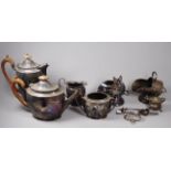 A 20th century silverplated four piece tea service - of faceted oval form with fruitwood handles and