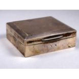A silver cigarette box - Birmingham 1951, engine turned with chamfered edges, width 10cm