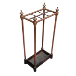 A brass and cast iron umbrella stand - rectangular with a frame of six apertures, width 31cm,