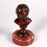 19th century school bronze study of a young boy - head and shoulders raised on a socle and red