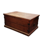 A late 19th century pine trunk - with steel binding and carrying handles, the rectangular hinged lid