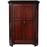 A George III mahogany standing corner cupboard - now reduced in size, the moulded cornice above a
