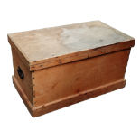 A late 19th century pine trunk - the rectangular hinged lid revealing a void interior, width 84cm,