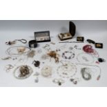 A quantity of costume jewellery - to include two Yves St Laurent gilt metal leaf form brooches and a