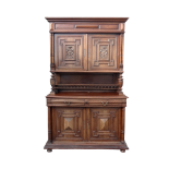 A late 19th century French walnut buffet - the upper section with a pair of carved panel doors above