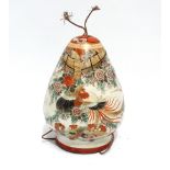 An early 20th century Japanese Satsuma hanging vase - of conical form decorated with a pheasant in a