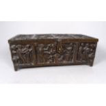 A 19th century bronze gothic revival casket - decorated with panels showing figures, raised on short