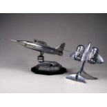 A Gala-Sonic chrome plated table lighter - modelled in the form of a fast jet mounted on a gimble on