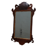 A late George III mahogany fretwork wall mirror - the rectangular plate with cusped corners to the