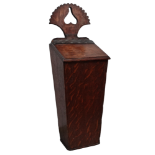 A 19th century oak candle box - of square tapering form surmounted by a pierced bracket, width