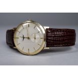 A gentlemans Longines wristwatch - circa 1959, gilt metal watch head with cream dial set out in