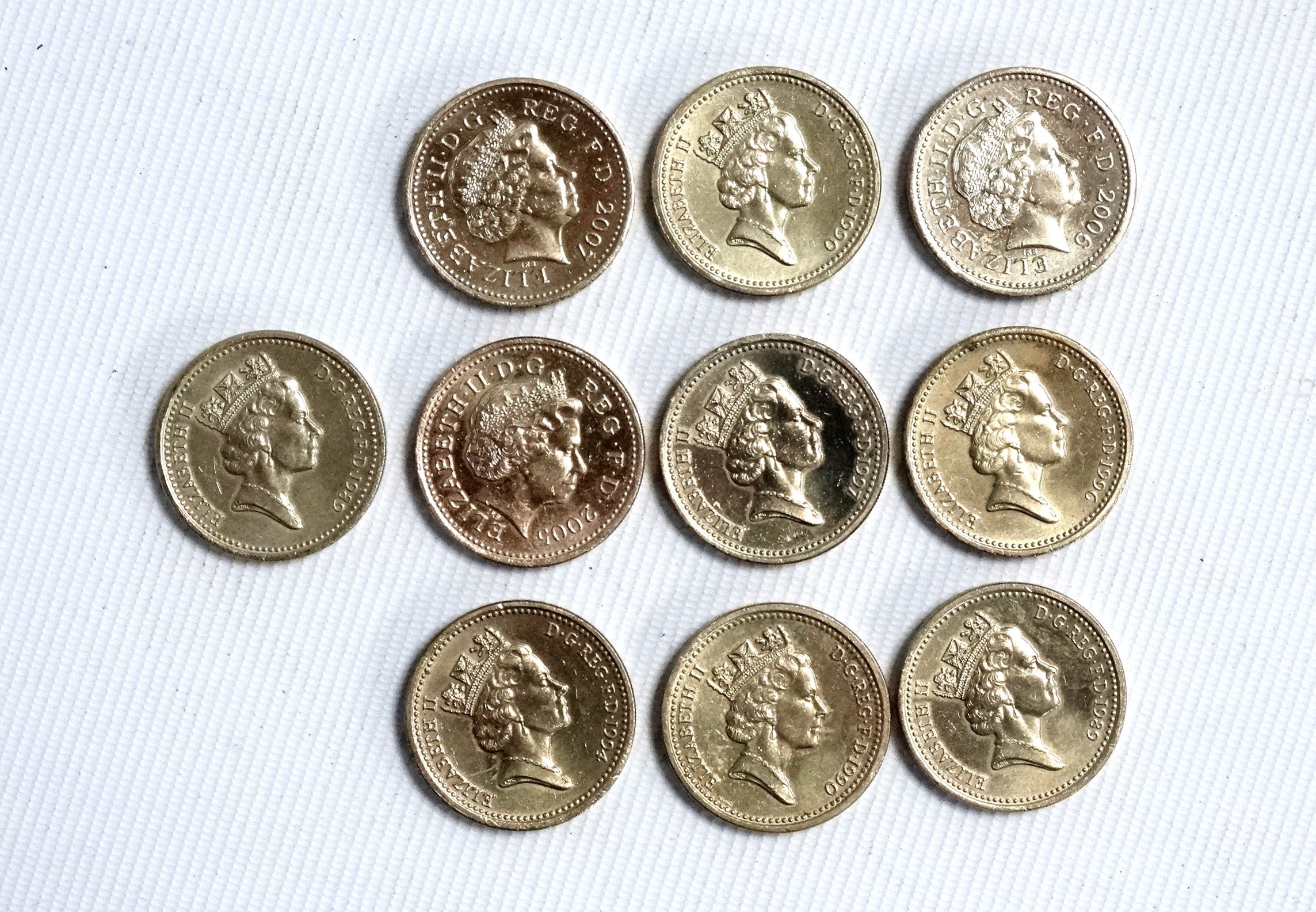 Ten £1 coins - various reverses, 1989, 1990, 1994, 1996, 1997, 2005, 2006 and 2007.