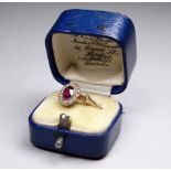 An amethyst and pearl dress ring - the oval setting on a 9ct yellow gold band, weight 2g, boxed.