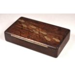 A stained oak box - rectangular and set with white metal footsteps across the lid, width 15cm.