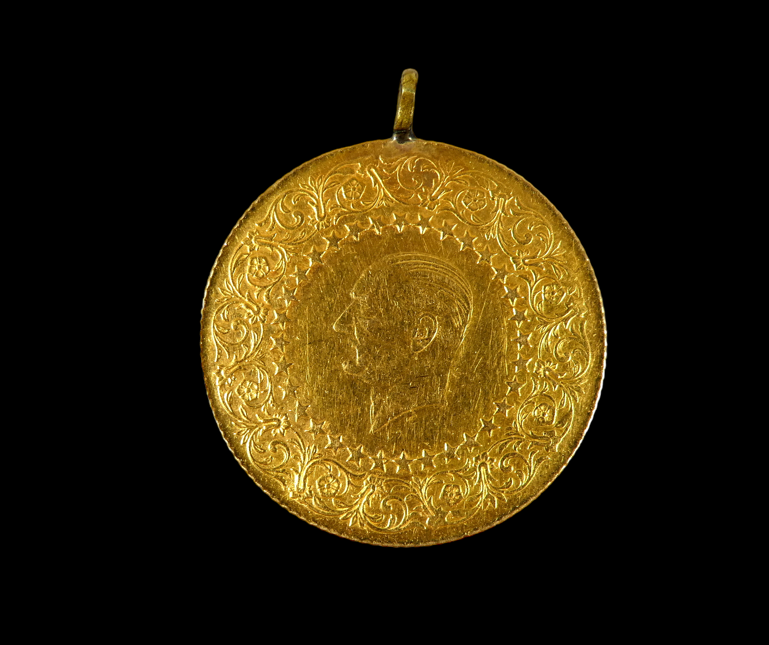 A Turkish 1960 fifty Kurus gold coin - head withing a foliate border reverse, script and dated