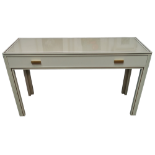 A Pierre Vandel, Paris cream console table - the rectangular top with gilt lining above a frieze