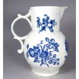A mid 18th century Worcester blue and white jug circa 1765 - with mask spout, impressed cabbage leaf