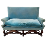 A George II style upholstered sofa - upholstered in green velvet and raised on walnut S scroll