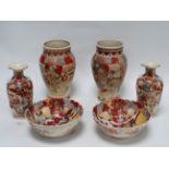 A pair of early 20th century Satsuma vases - with moulded handles and tubeline decorated with