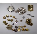 An early 20th century steel cased pocket watch - together with a quantity of buttons and badges, a